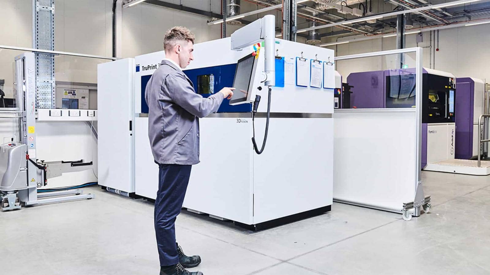 MTC engineer operating additive manufacturing machinery