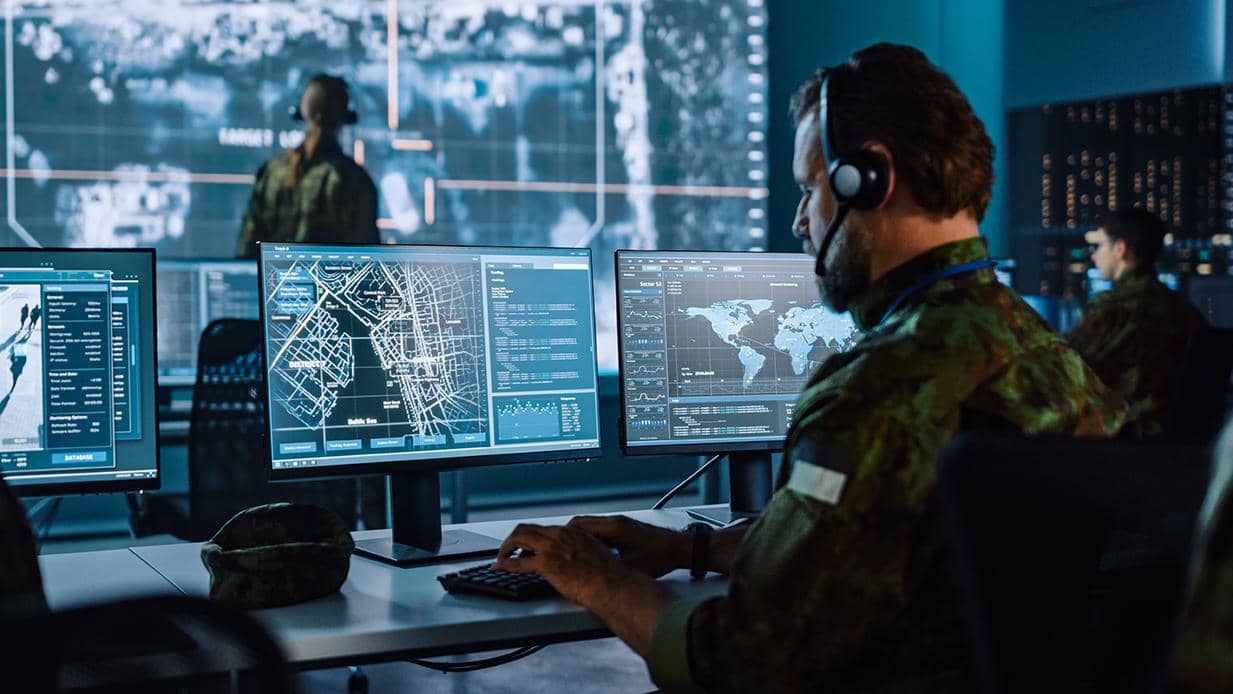 Soldier reviewing security screen